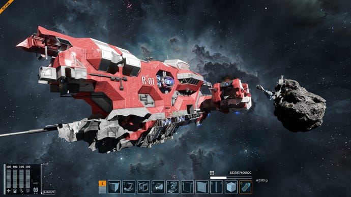 A huge red freighter tumbles towards the player in space.