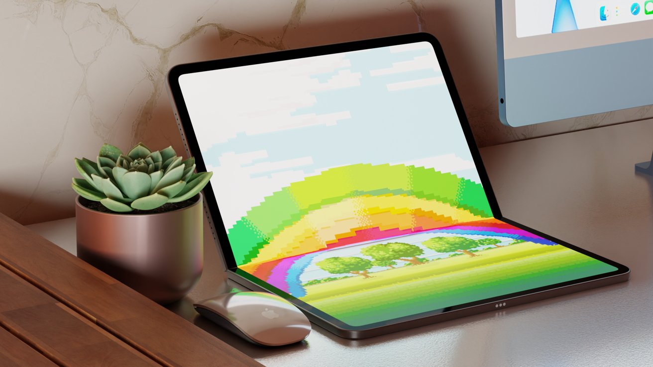 Foldable tablet displaying a pixelated rainbow and trees, next to a potted succulent, mouse, and desktop computer on a wooden desk with stone background.