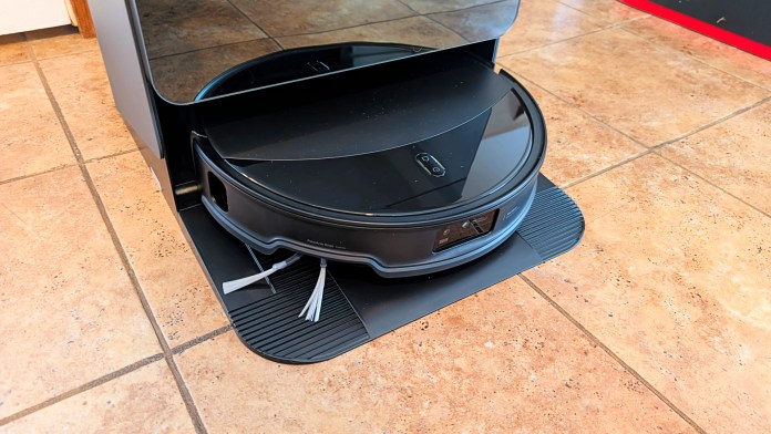 Close-up of the Roborock Saros 10R robot vacuum dock, showcasing its sleek design and integrated storage for the vacuum.