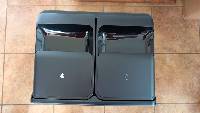 Top view of the Roborock multifunctional dock with two compartments for water and detergent.