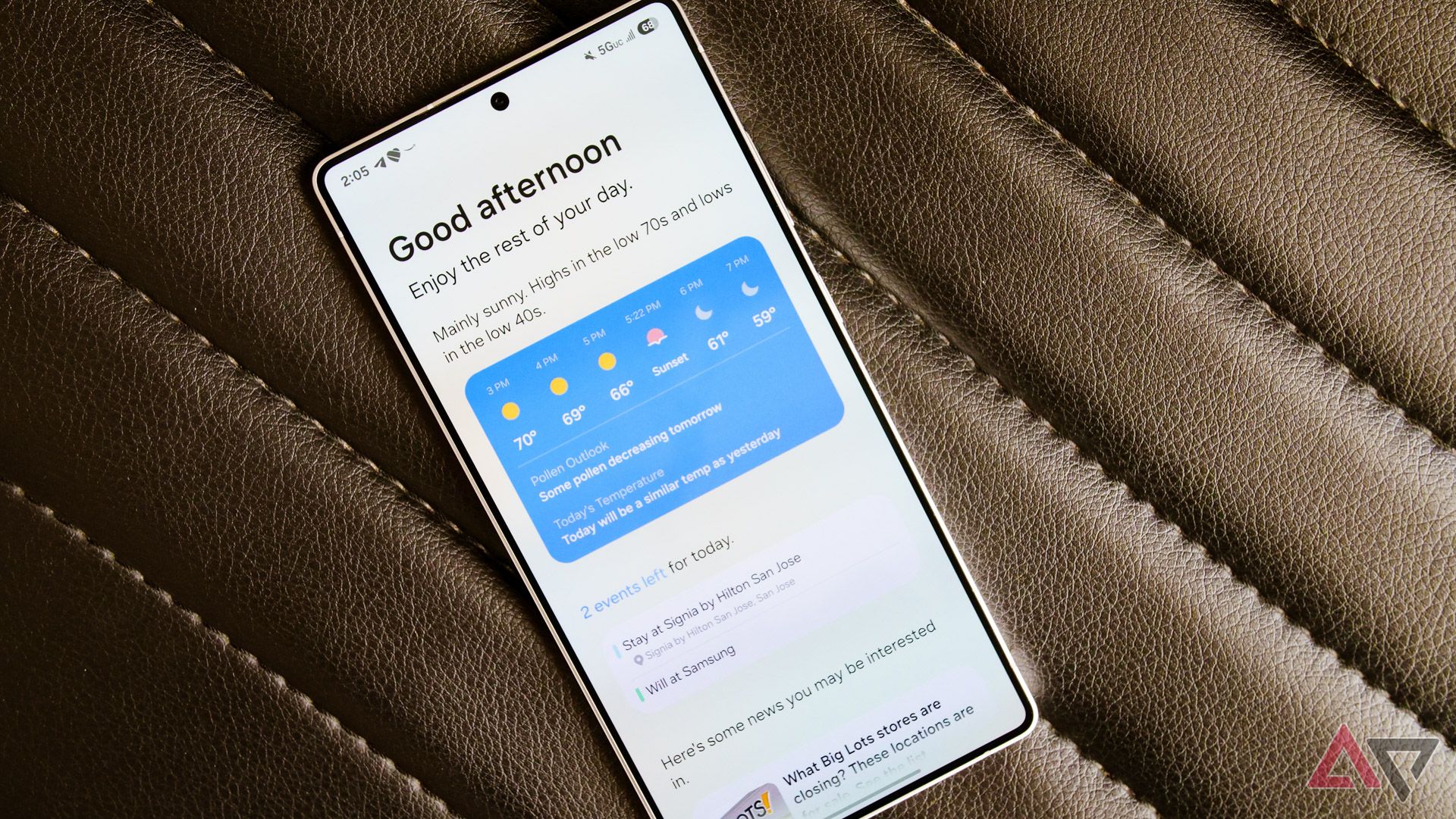 Samsung Galaxy S25 Ultra with the screen on showing lock screen notifications and AI