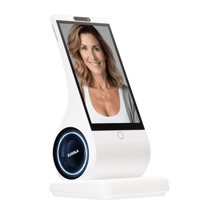 EUVOLA emotional AI companion device with an HD touchscreen displaying a smiling woman's face, designed for emotional presence and human connection.