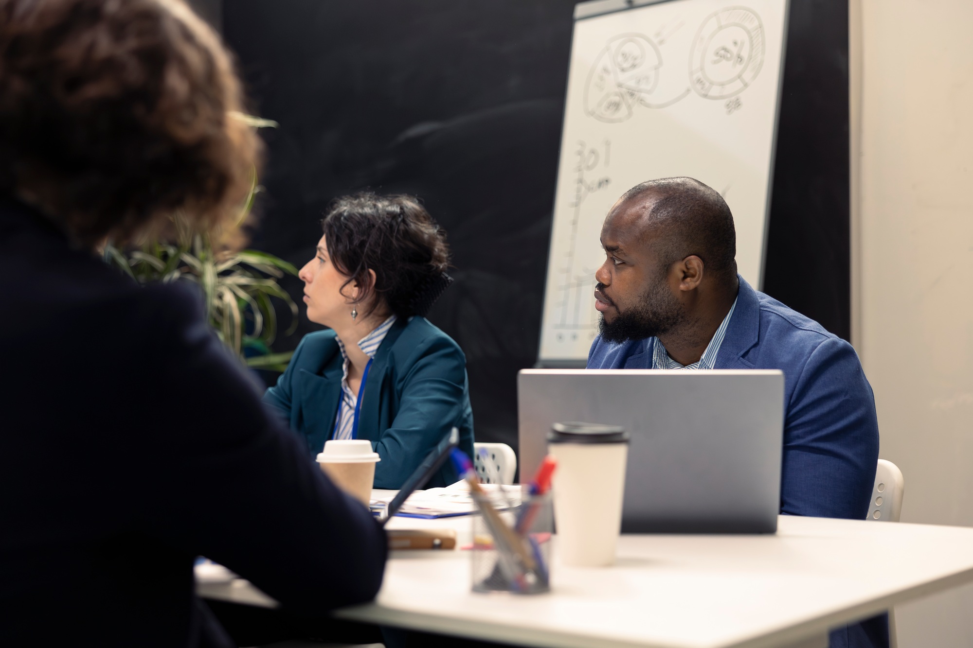 Staff members gathers for informal discussion to discover financing sources