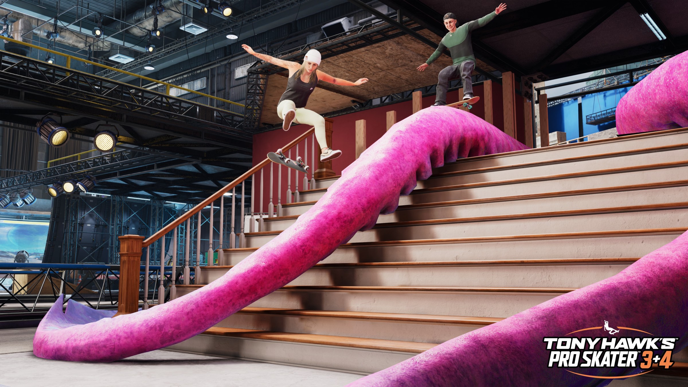 Two skaters grind and jump off a tentacle prop from the Movie Studio level in a screenshot from Tony Hawk’s Pro Skater 3 and 4