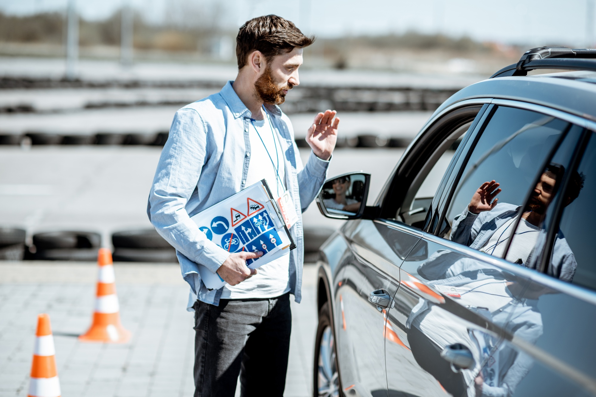 Instructor with driver on the training ground