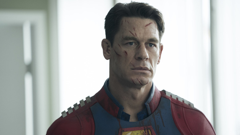 John Cena as Peacemaker with cut marks all over his face in Peacemaker