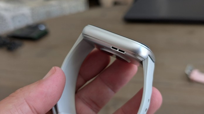 Close-up view of the side of the Runmefit Watch 4, showcasing its sleek design and charging port.