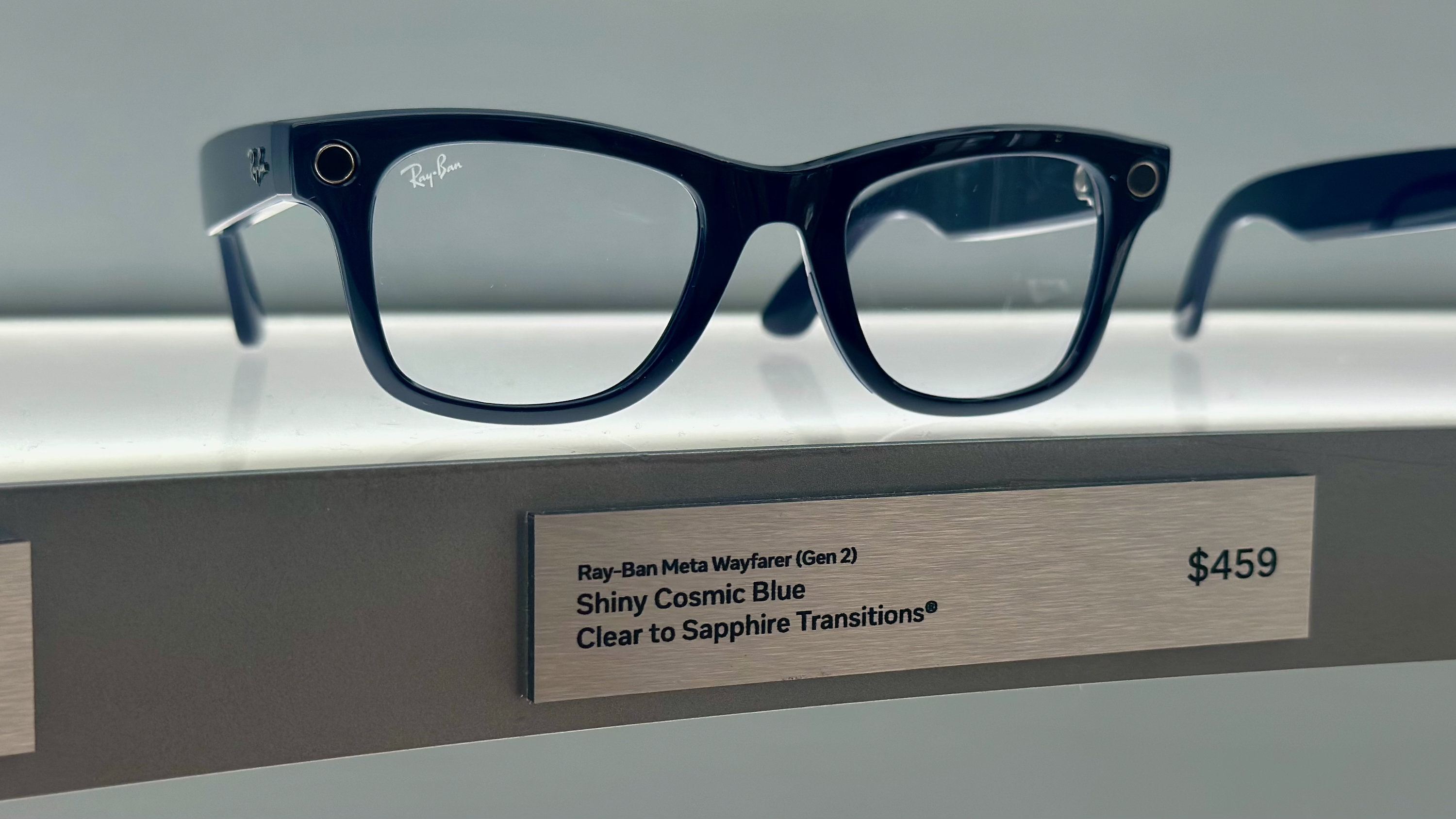 Wayfarer Ray-Ban Meta (Gen 2) glasses in Shiny Cosmic Blue with Clear to Sapphire Transitions lenses.