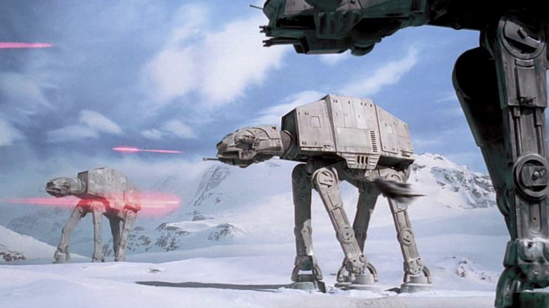 Three AT-ATs shooting lasers at the Rebellion forces on Hoth in The Empire Strikes Back