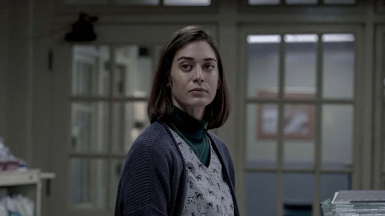 Annie Wilkes standing in a corridor on Castle Rock