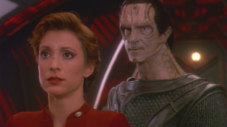 Nana Visitor as Kira Nerys standing in front of Marc Alaimo as Gul Dukat on Star Trek: Deep Space Nine