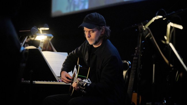 LOS ANGELES, CALIFORNIA - JANUARY 08: Bryce Dessner performs onstage during Netflix's "Train Dreams" Live to Screen Event at the Egyptian Theater on January 08, 2026 in Los Angeles, California. (Photo by Gonzalo Marroquin/Getty Images)
