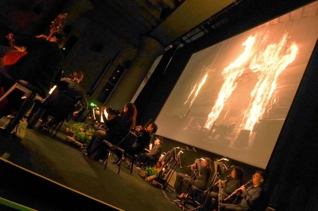 LOS ANGELES, CALIFORNIA - JANUARY 08: The Wordless Music Orchestra performs onstage during Netflix's "Train Dreams" Live to Screen Event at the Egyptian Theater on January 08, 2026 in Los Angeles, California. (Photo by Gonzalo Marroquin/Getty Images)