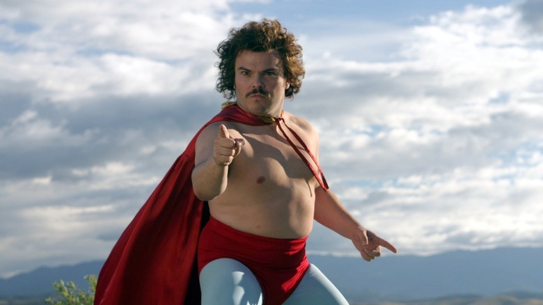 Ignacio, in his luchador cape against a blue sky in Nacho Libre